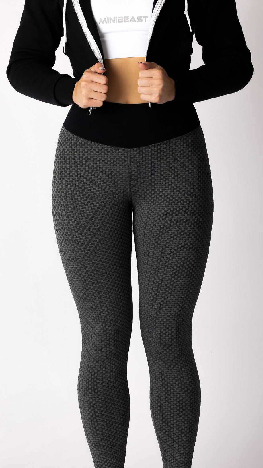 The front view of a model wearing Curve Classic Leggings in Hex Black. 